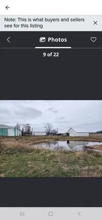 a view of a lake with houses in front of it