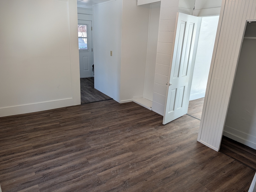 9 Turnpike Road, Unit 2 Montague, MA 01376 - Photo 11 of 21 an empty room with wooden floor and entrance