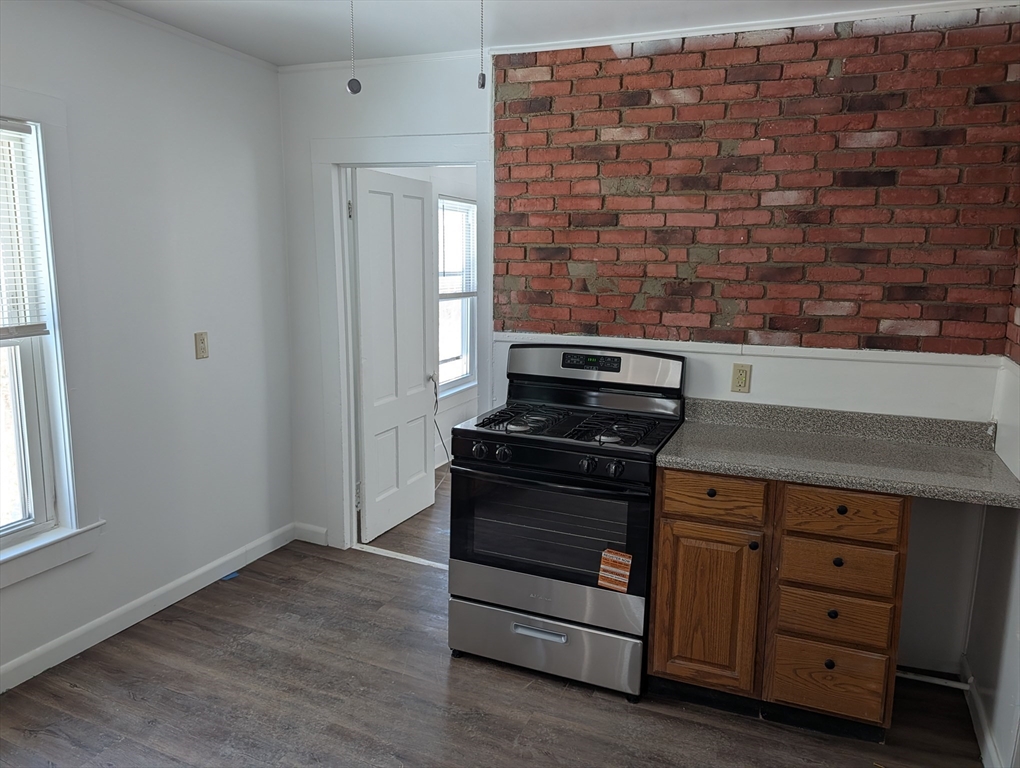 9 Turnpike Road, Unit 2 Montague, MA 01376 - Photo 2 of 21 a kitchen with a stove and a cabinet