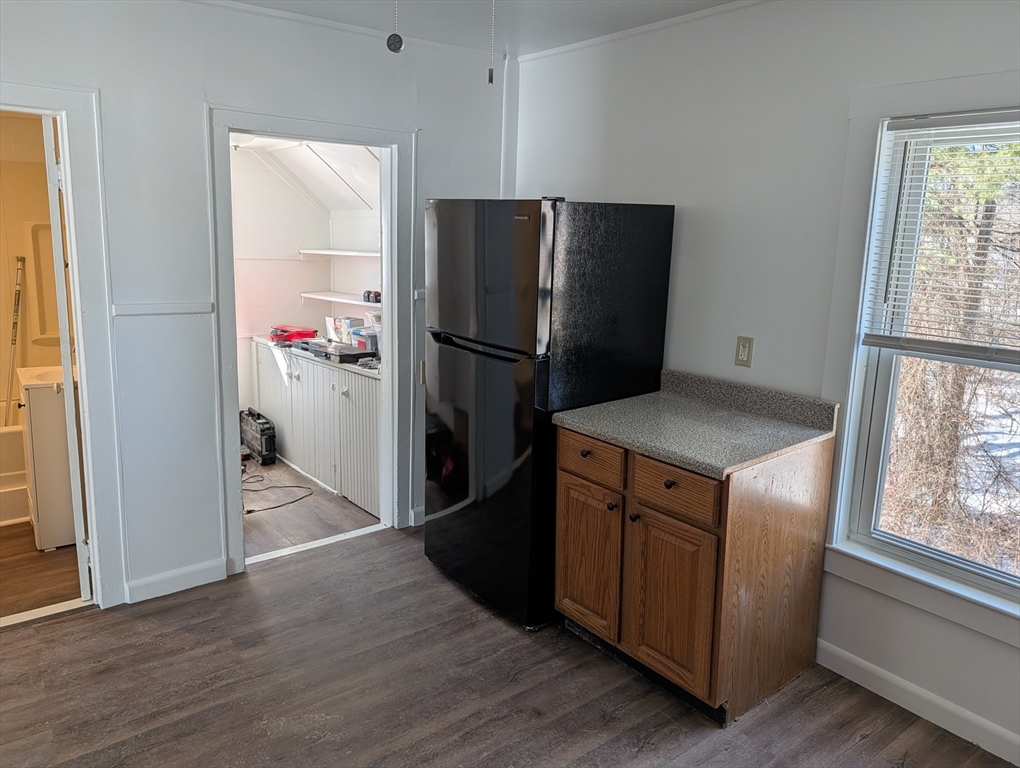 9 Turnpike Road, Unit 2 Montague, MA 01376 - Photo 5 of 21 a kitchen with a refrigerator cabinet and a stove top oven