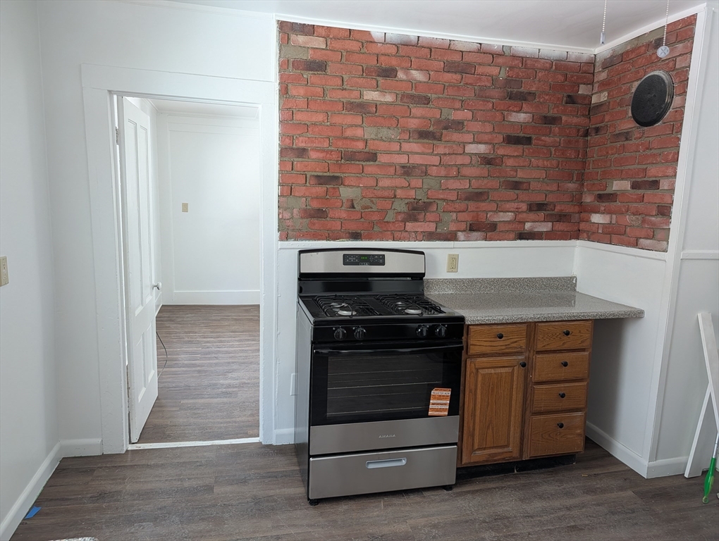 9 Turnpike Road, Unit 2 Montague, MA 01376 - Photo 6 of 21 a kitchen with a stove and a cabinet