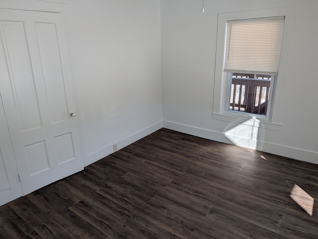 9 Turnpike Road, Unit 2 Montague, MA 01376 - Photo 10 of 21 a view of an empty room with wooden floor and a window