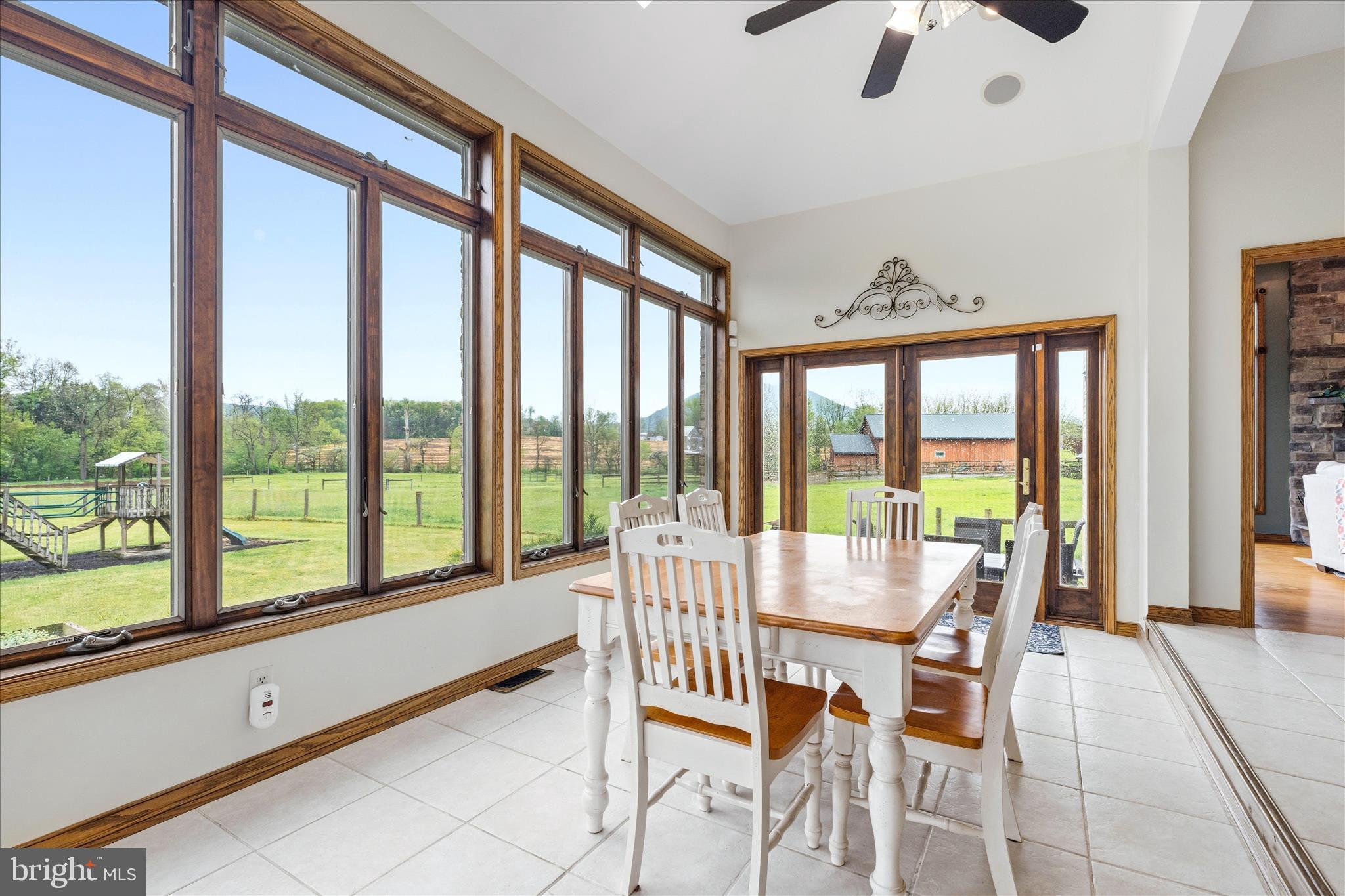 11820 Shimpstown Road Mercersburg, PA 17236 - Photo 13 of 75 a dining room with furniture water view and a floor to ceiling window