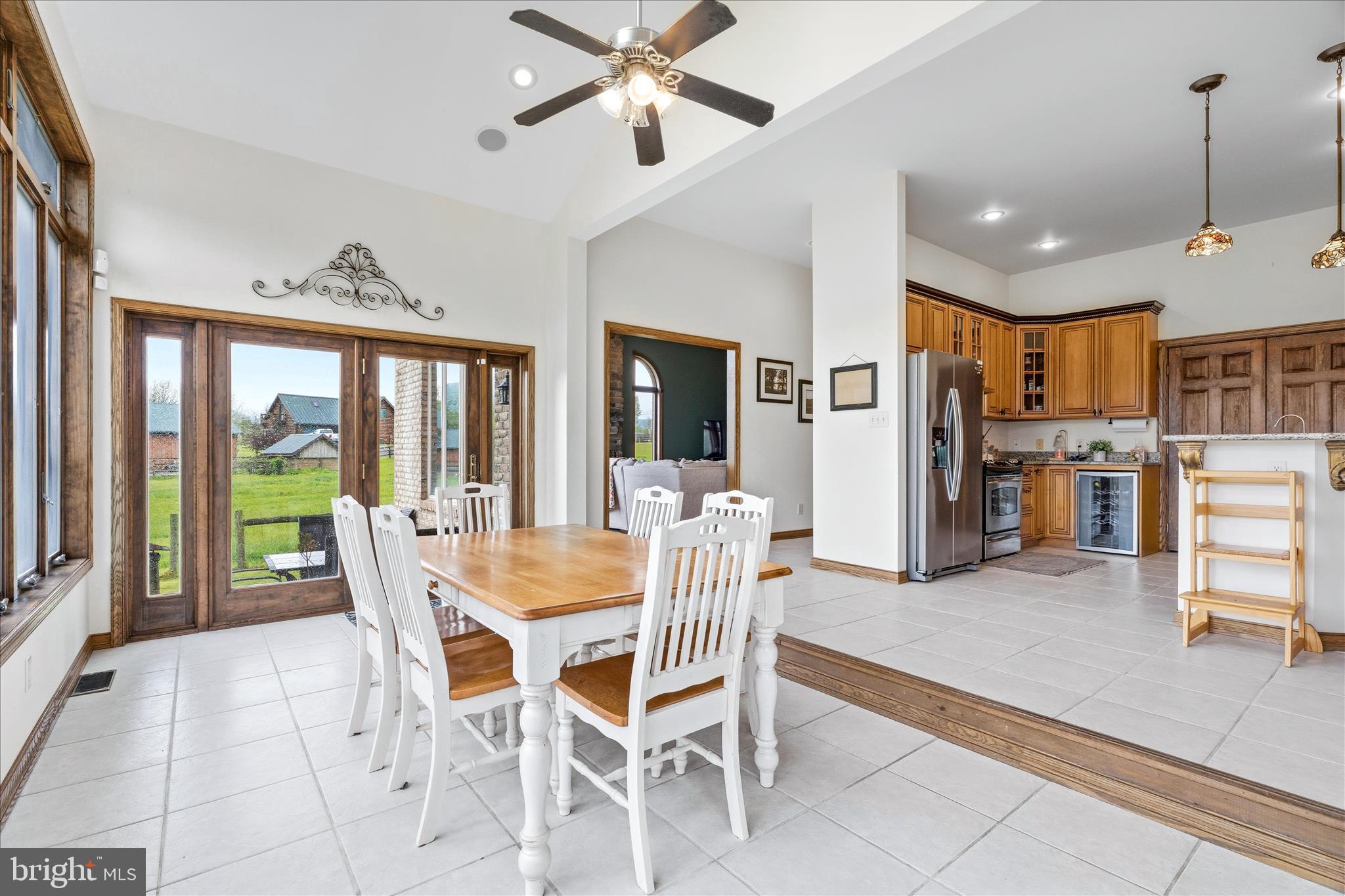 11820 Shimpstown Road Mercersburg, PA 17236 - Photo 14 of 75 a dining room with furniture a chandelier and kitchen view