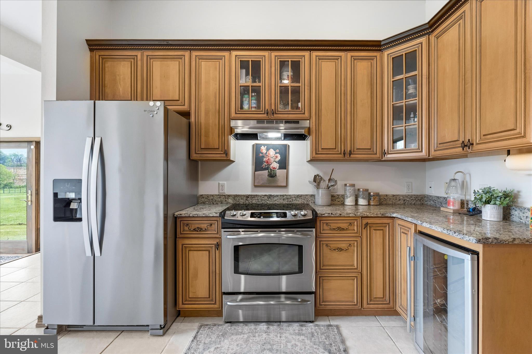 11820 Shimpstown Road Mercersburg, PA 17236 - Photo 19 of 75 a kitchen with granite countertop a stove top oven cabinetry and stainless steel appliances