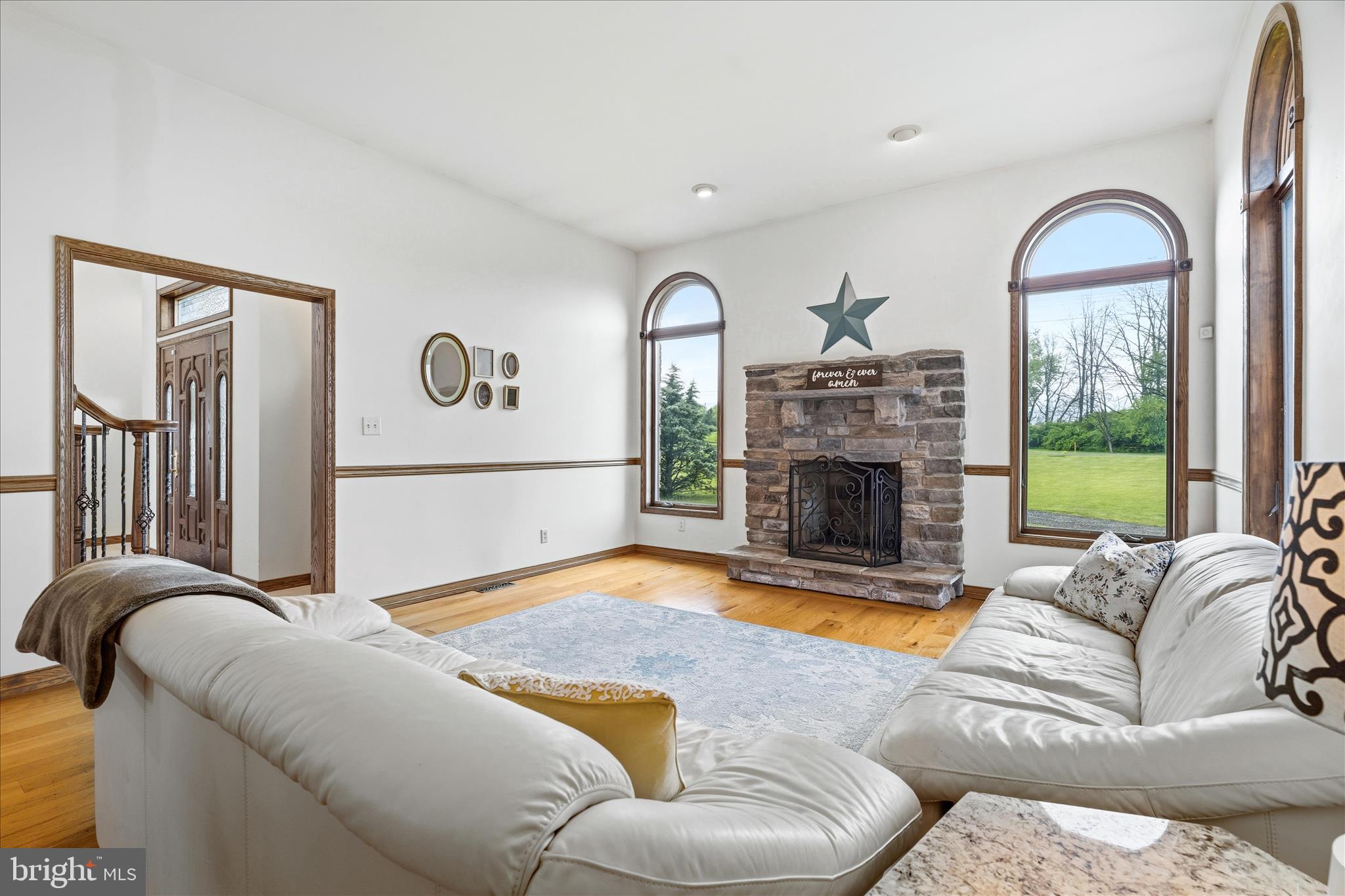 11820 Shimpstown Road Mercersburg, PA 17236 - Photo 23 of 75 a living room with furniture a fireplace and a large window