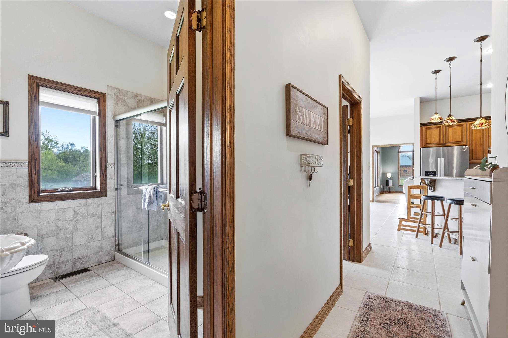 11820 Shimpstown Road Mercersburg, PA 17236 - Photo 26 of 75 a bathroom with a toilet a sink and a window
