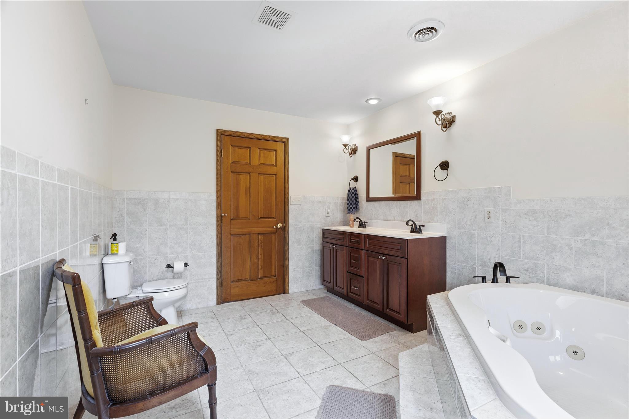 11820 Shimpstown Road Mercersburg, PA 17236 - Photo 35 of 75 a spacious bathroom with a tub sink and mirror