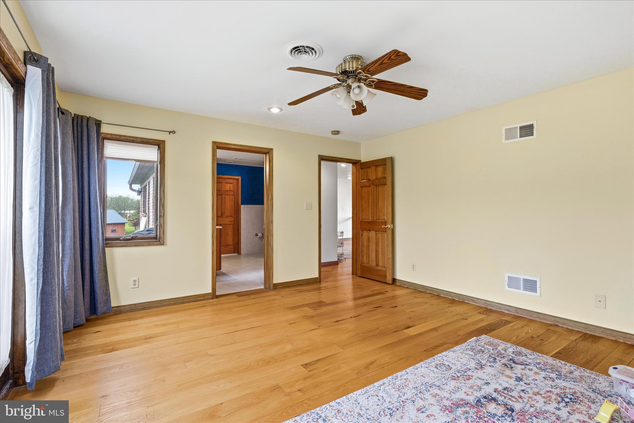 11820 Shimpstown Road Mercersburg, PA 17236 - Photo 38 of 75 a view of a big room with wooden floor and windows