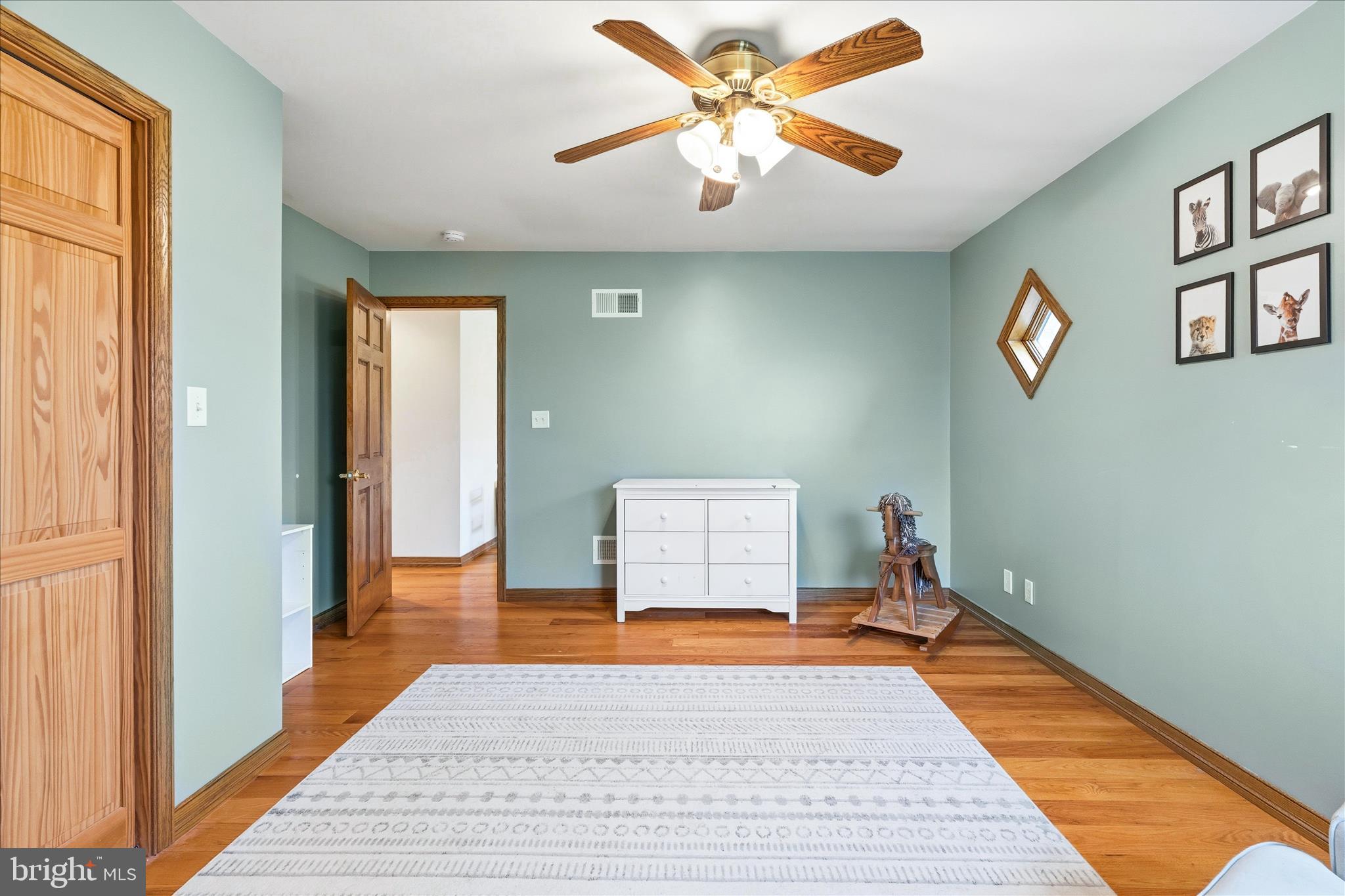 11820 Shimpstown Road Mercersburg, PA 17236 - Photo 42 of 75 a bedroom with a bed and a chandelier