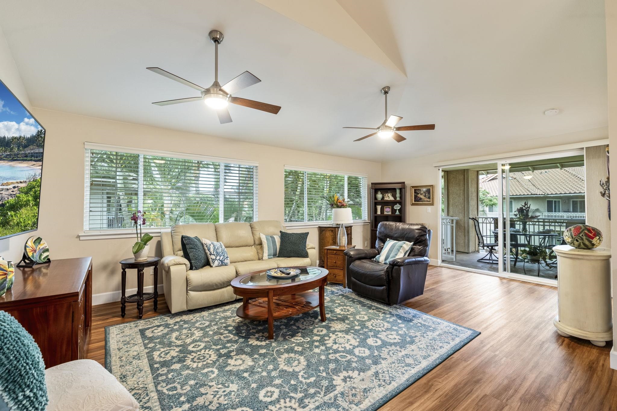 16 Kai Makani Loop, Unit D201 Kihei, HI 96753 - Photo 1 of 50 a living room with furniture large window and wooden floor