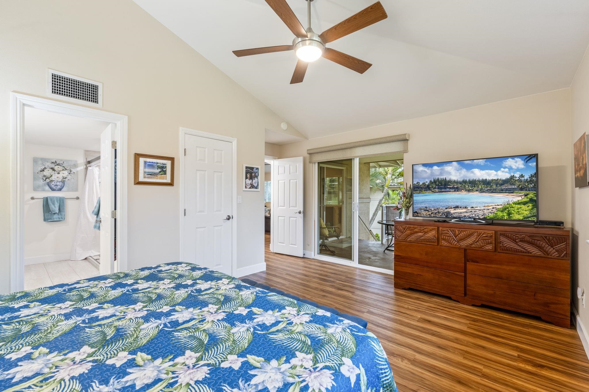16 Kai Makani Loop, Unit D201 Kihei, HI 96753 - Photo 13 of 50 a bedroom with a bed and a flat screen tv