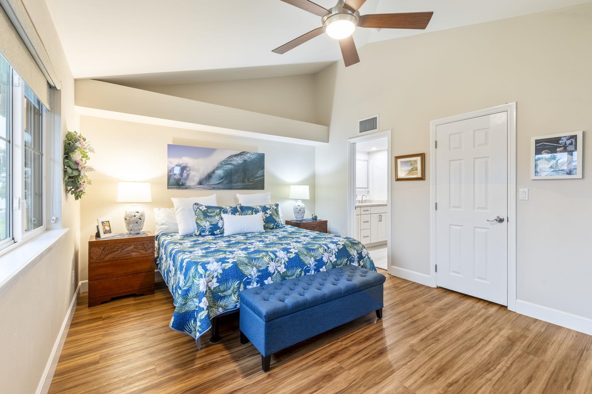 16 Kai Makani Loop, Unit D201 Kihei, HI 96753 - Photo 14 of 50 a bedroom with a bed and wooden floor