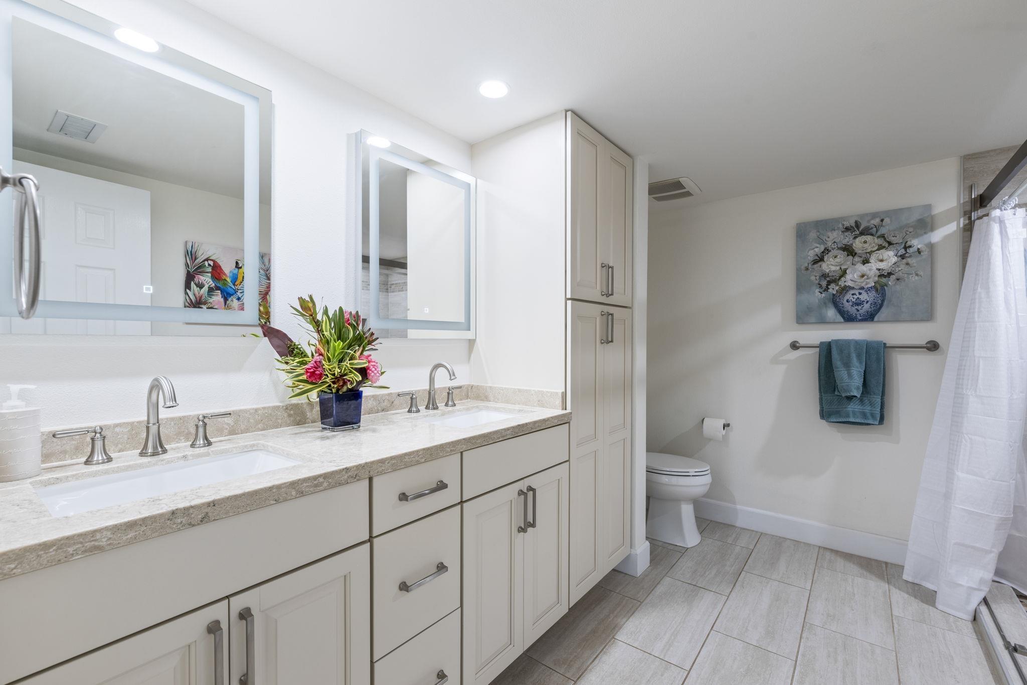 16 Kai Makani Loop, Unit D201 Kihei, HI 96753 - Photo 17 of 50 a spacious bathroom with a granite countertop sink mirror and toilet