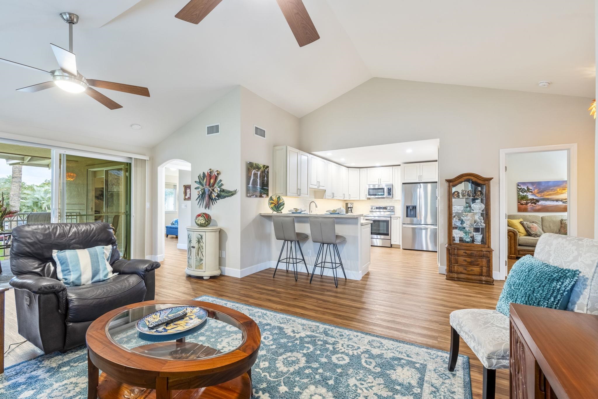 16 Kai Makani Loop, Unit D201 Kihei, HI 96753 - Photo 2 of 50 a living room with furniture and a dining table