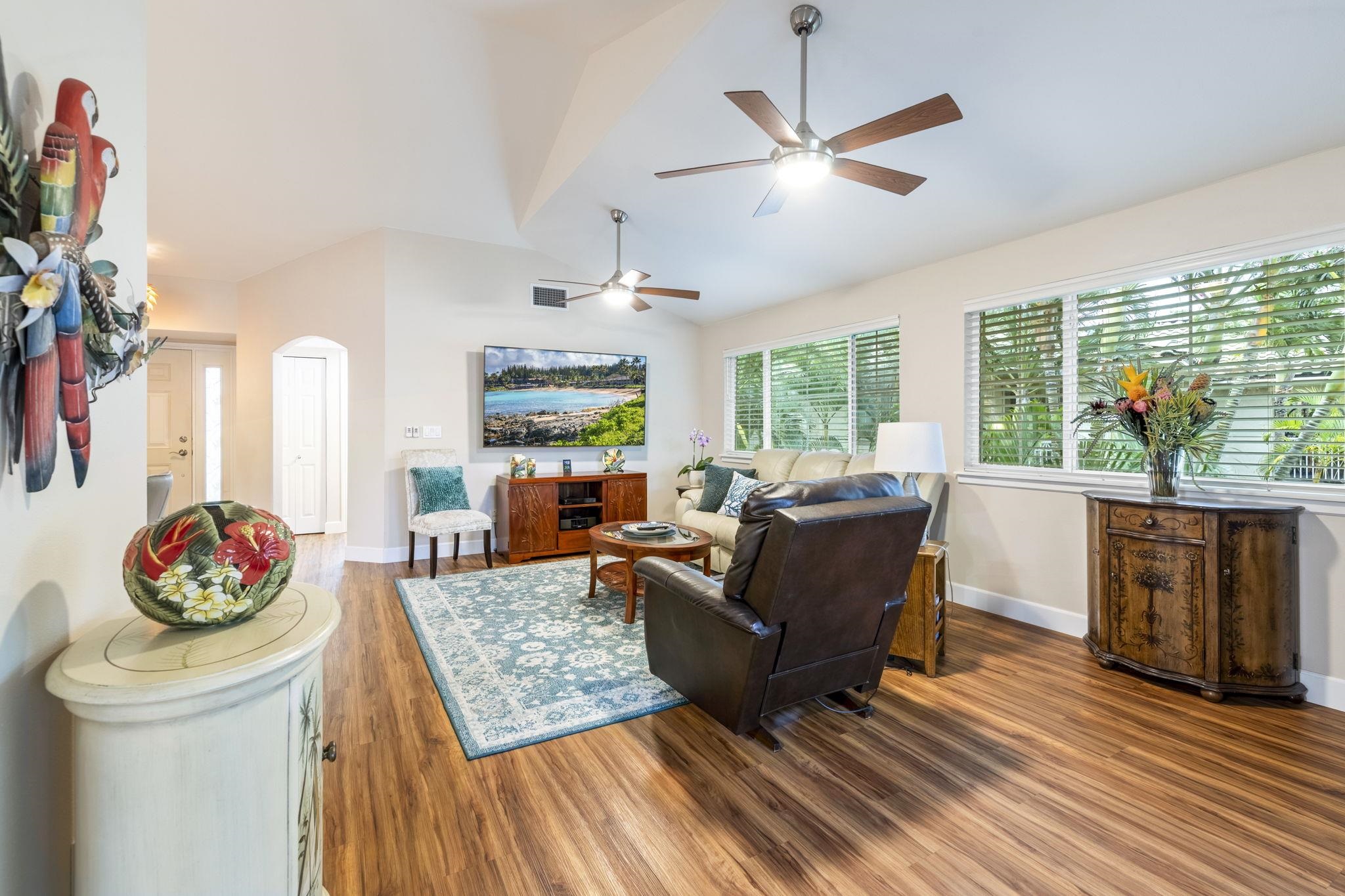 16 Kai Makani Loop, Unit D201 Kihei, HI 96753 - Photo 4 of 50 a living room with furniture and a large window