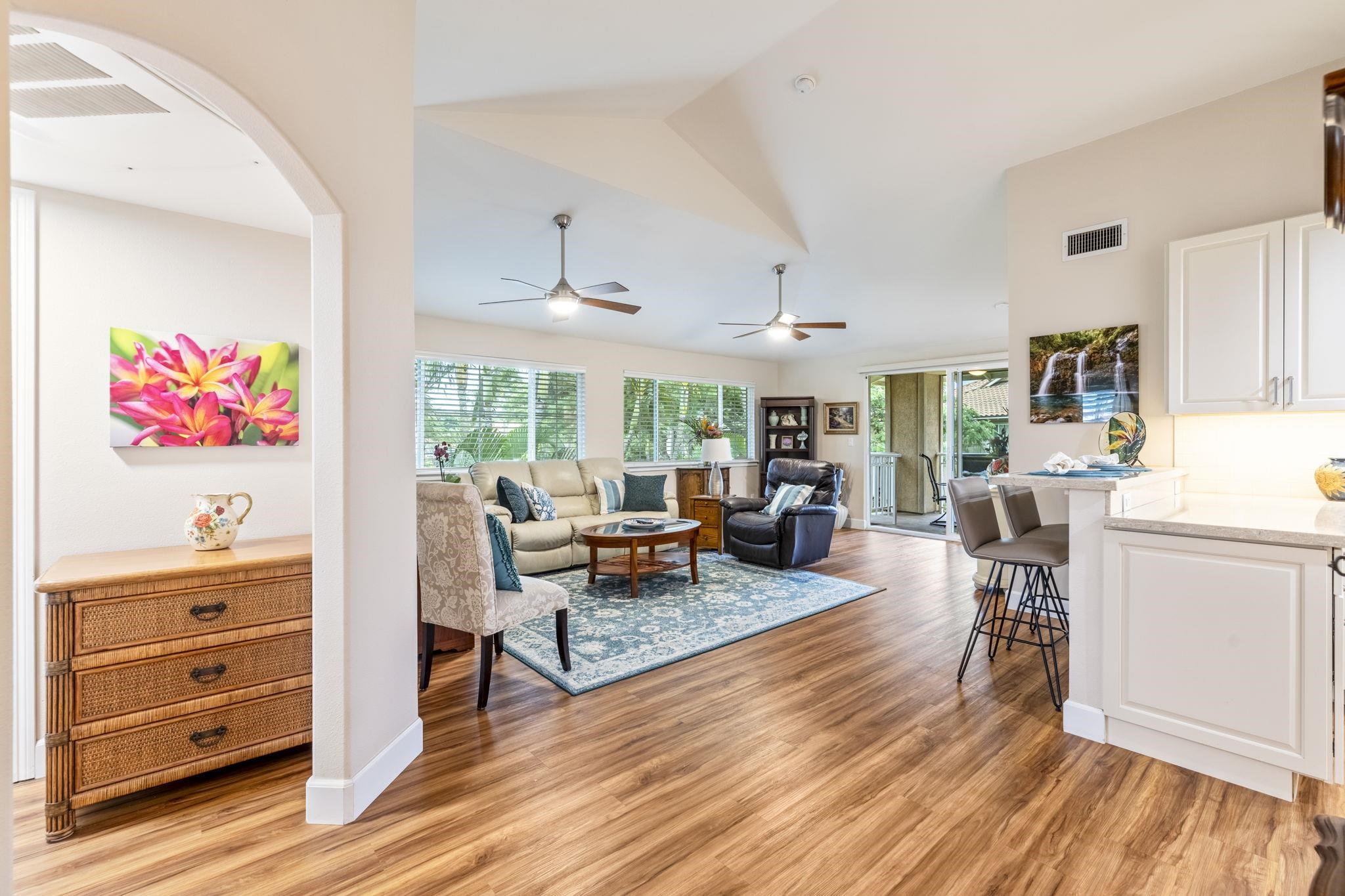16 Kai Makani Loop, Unit D201 Kihei, HI 96753 - Photo 5 of 50 a living room with furniture and a wooden floor
