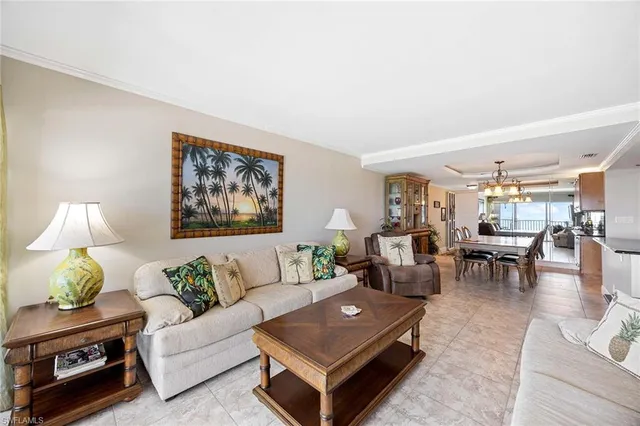 a living room with furniture and a lamp