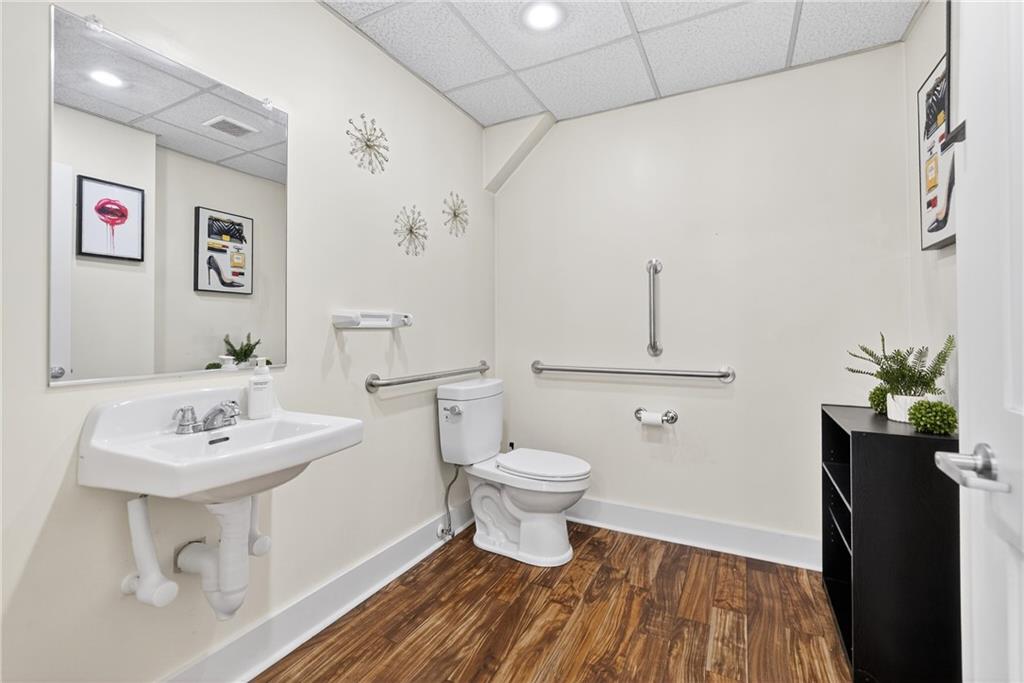 320 West Main Street Mount Pleasant, PA 15666 - Photo 13 of 37 a bathroom with a sink toilet and a mirror