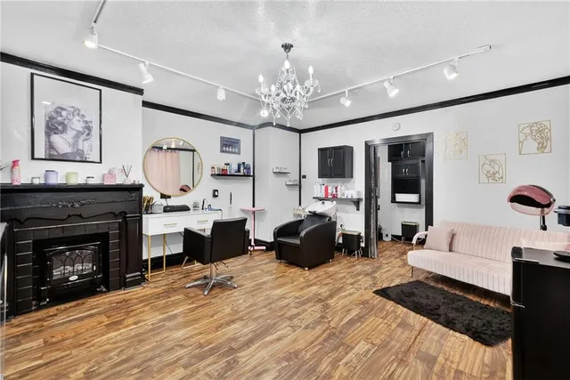 a bedroom with furniture fireplace and window