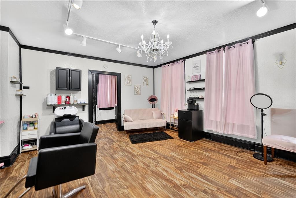 320 West Main Street Mount Pleasant, PA 15666 - Photo 18 of 37 a bedroom with furniture and a chandelier