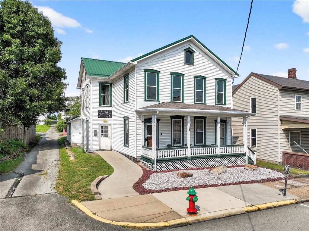 320 West Main Street Mount Pleasant, PA 15666 - Photo 2 of 37 a front view of a house with garden