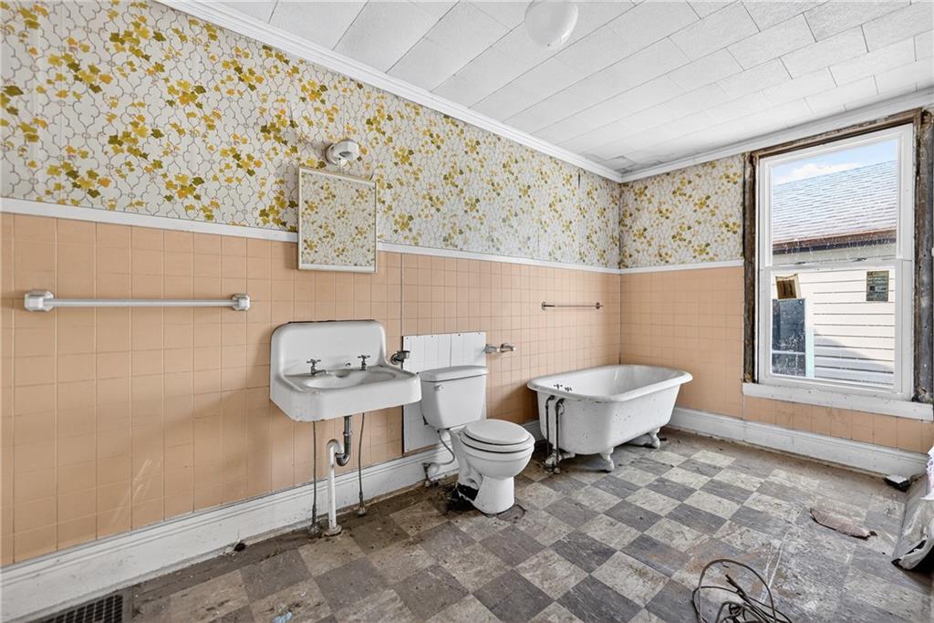 320 West Main Street Mount Pleasant, PA 15666 - Photo 31 of 37 a bathroom with a toilet sink and tub