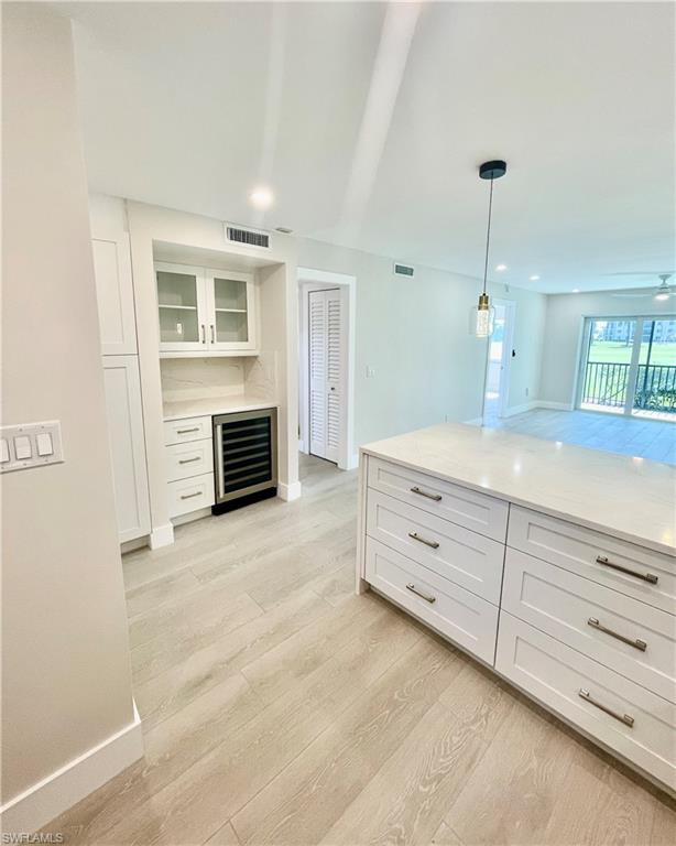 a view of living room with furniture and fireplace