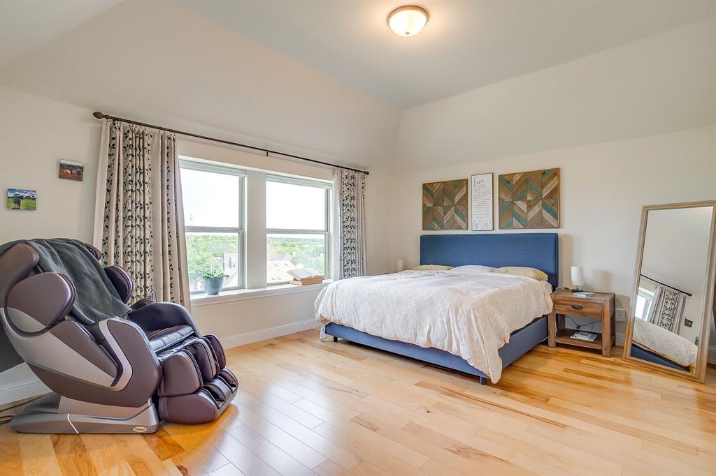 416 Bluffside Trail Benbrook, TX 76126 - Photo 21 of 40 a bedroom with a bed and wooden floor