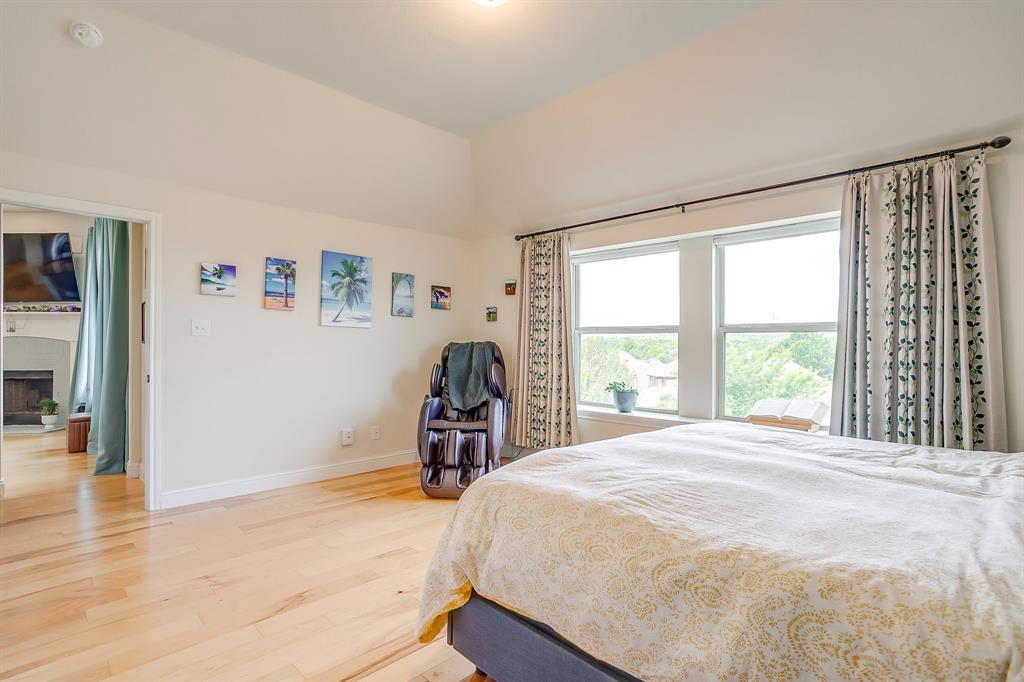 416 Bluffside Trail Benbrook, TX 76126 - Photo 22 of 40 a bed sitting in a bedroom next to a window