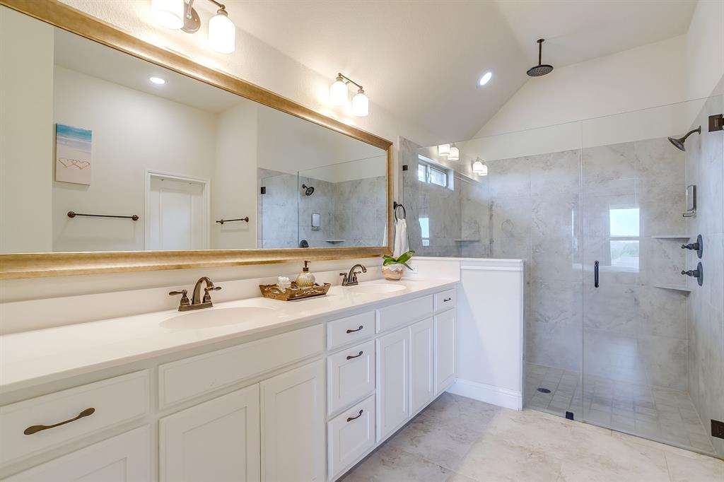 416 Bluffside Trail Benbrook, TX 76126 - Photo 24 of 40 a bathroom with a double vanity sink mirror and shower