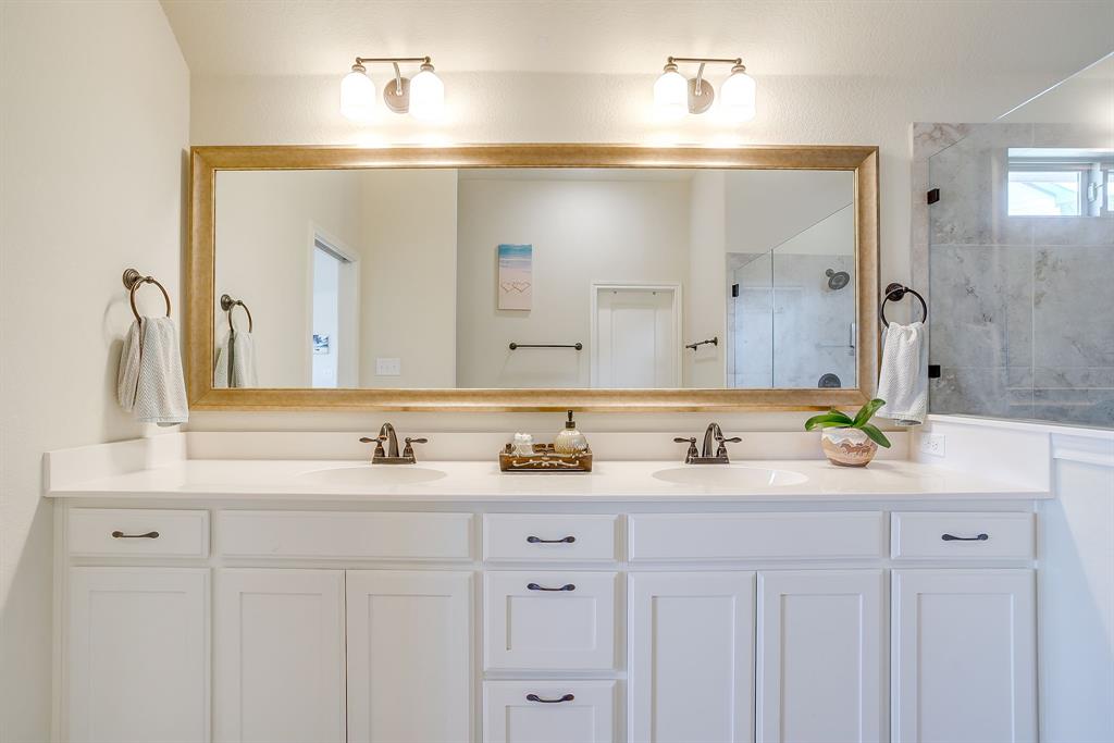 416 Bluffside Trail Benbrook, TX 76126 - Photo 25 of 40 a bathroom with double vanity sinks and a mirror