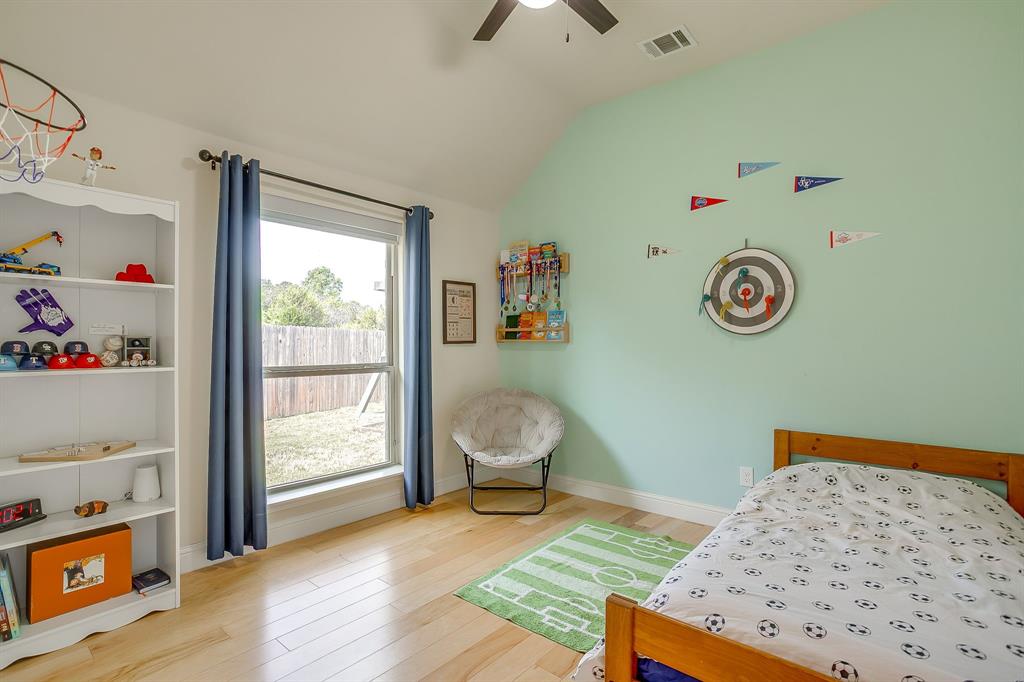 416 Bluffside Trail Benbrook, TX 76126 - Photo 28 of 40 a bedroom with a bed and a window