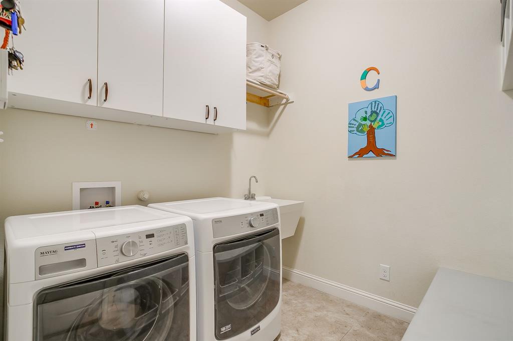 416 Bluffside Trail Benbrook, TX 76126 - Photo 29 of 40 a utility room with dryer and washer