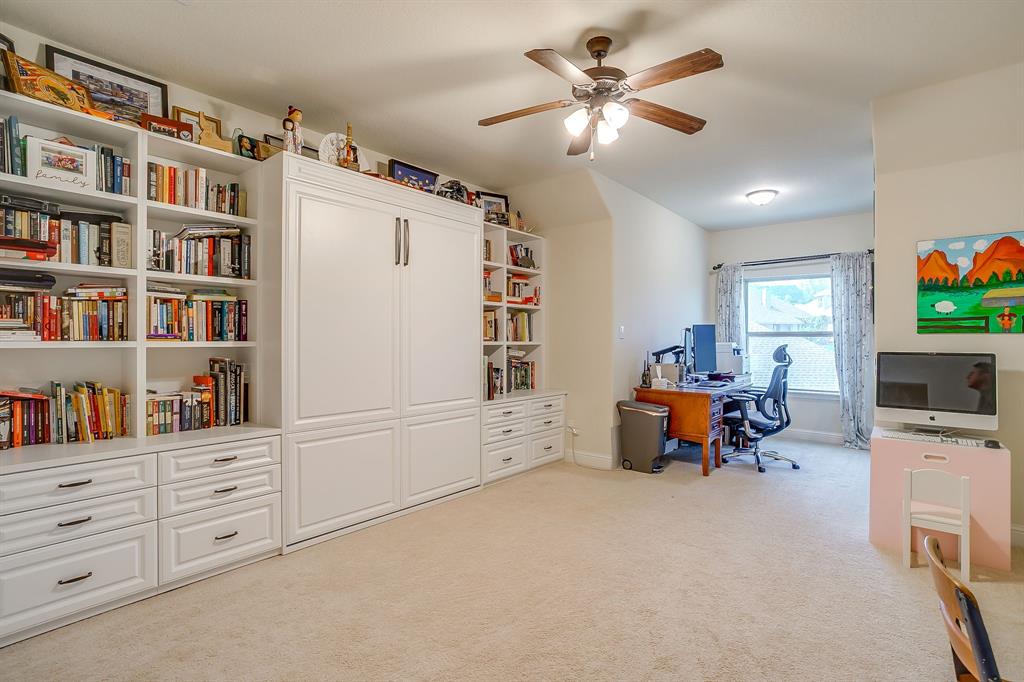 416 Bluffside Trail Benbrook, TX 76126 - Photo 32 of 40 a living room with furniture and a flat screen tv