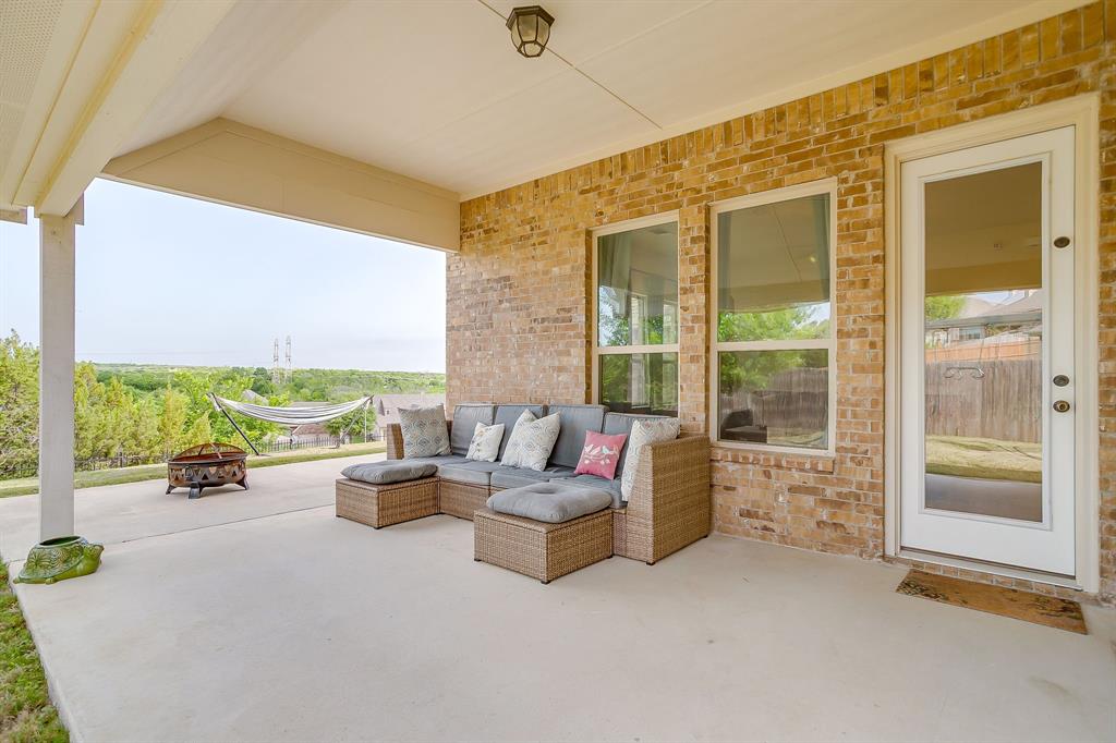 416 Bluffside Trail Benbrook, TX 76126 - Photo 37 of 40 a living room with furniture and a floor to ceiling window