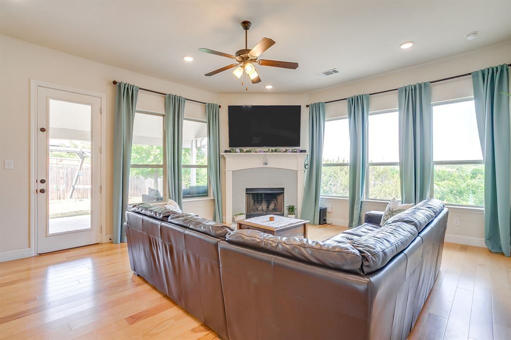 416 Bluffside Trail Benbrook, TX 76126 - Photo 9 of 40 a living room with furniture and a large window with wooden floor