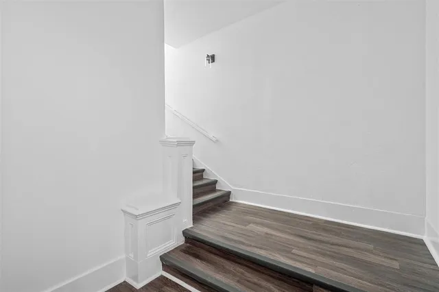 a view of entryway with wooden floor