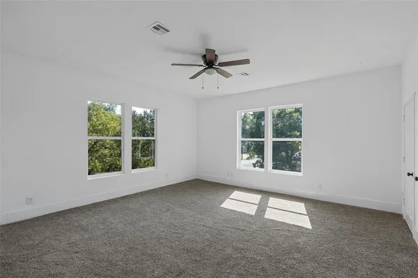a view of an empty room with a window
