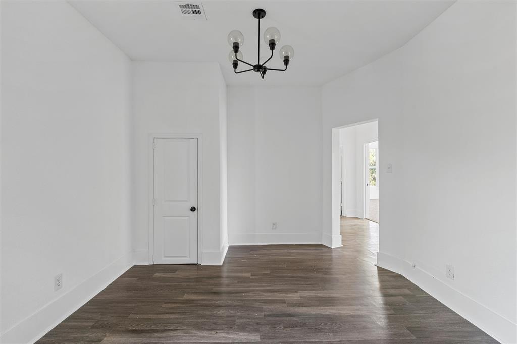 1825 Lyle Avenue Waco, TX 76708 - Photo 20 of 26 a view of a room with wooden floor and white walls