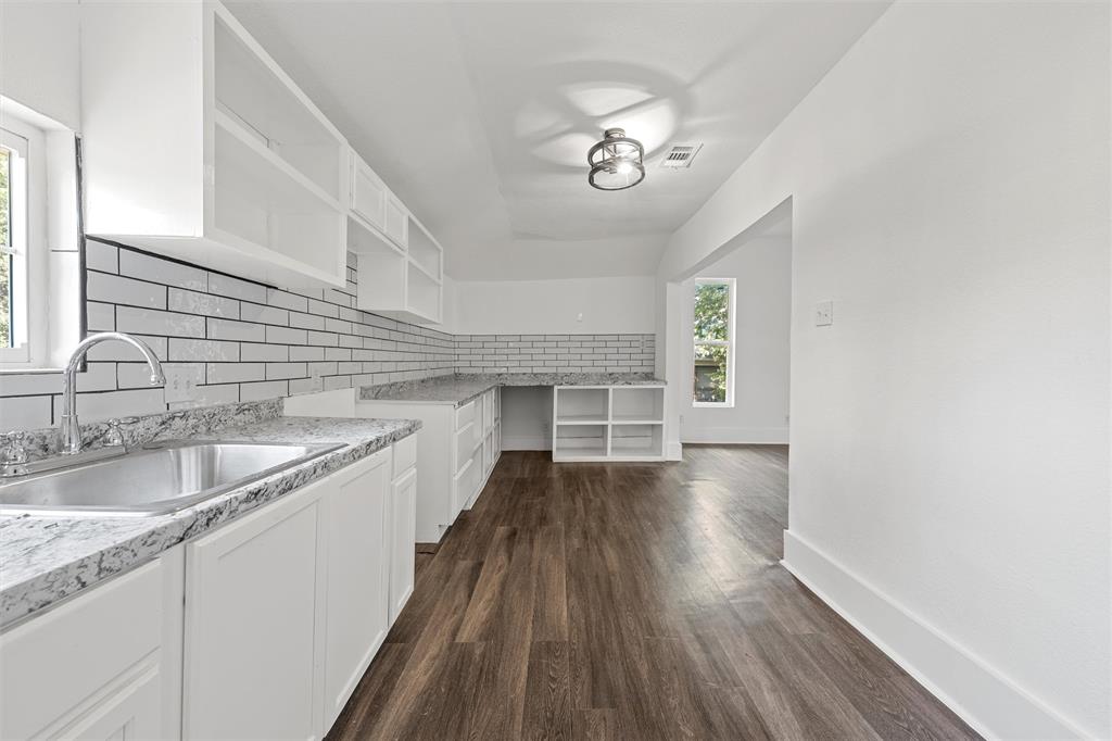 1825 Lyle Avenue Waco, TX 76708 - Photo 21 of 26 a view of a kitchen sink and wooden floor