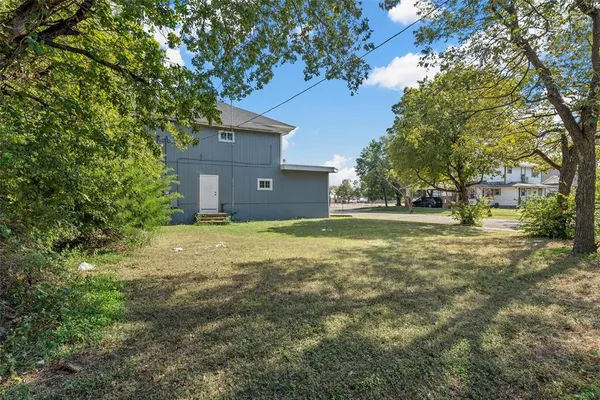 a view of outdoor space with deck and yard