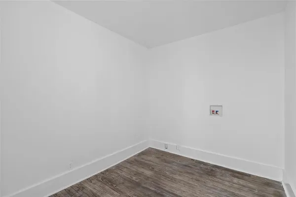 a view of a small space with wooden floor