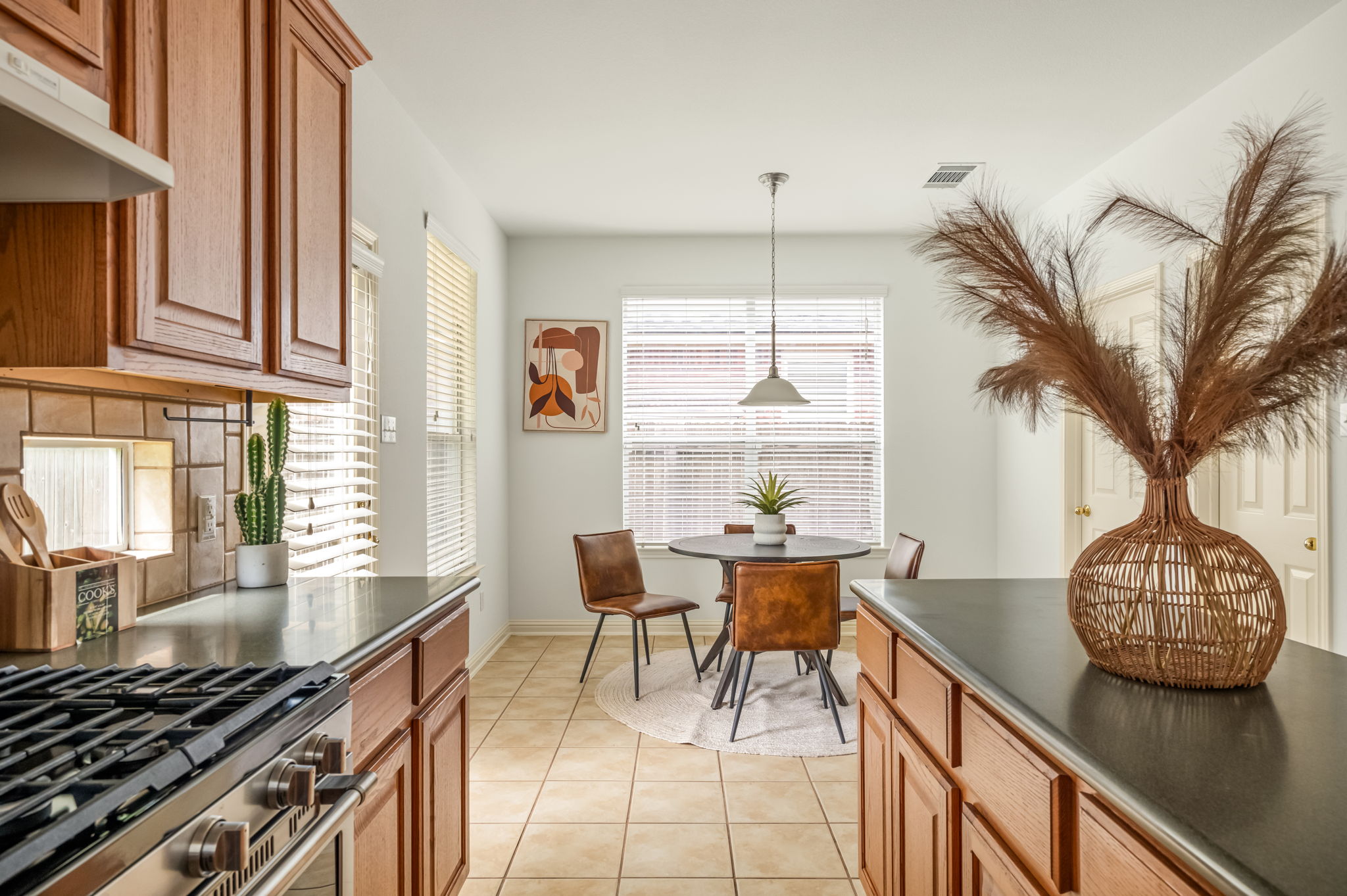 10004 Isle Royale Way Austin, TX 78747 - Photo 12 of 31 A well-appointed kitchen and dining area provides both function and flow.