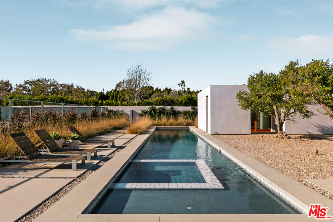 6728 Wildlife Road Malibu, CA 90265 - Photo 44 of 57 a view of a swimming pool with a lake view