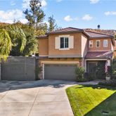 a view of house with yard and entertaining space
