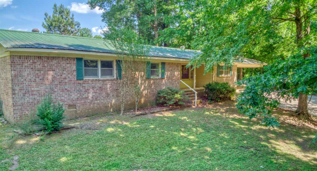 123 Lohrig Road Jackson, TN 38301 - Photo 4 of 24 a view of an house with backyard space and garden
