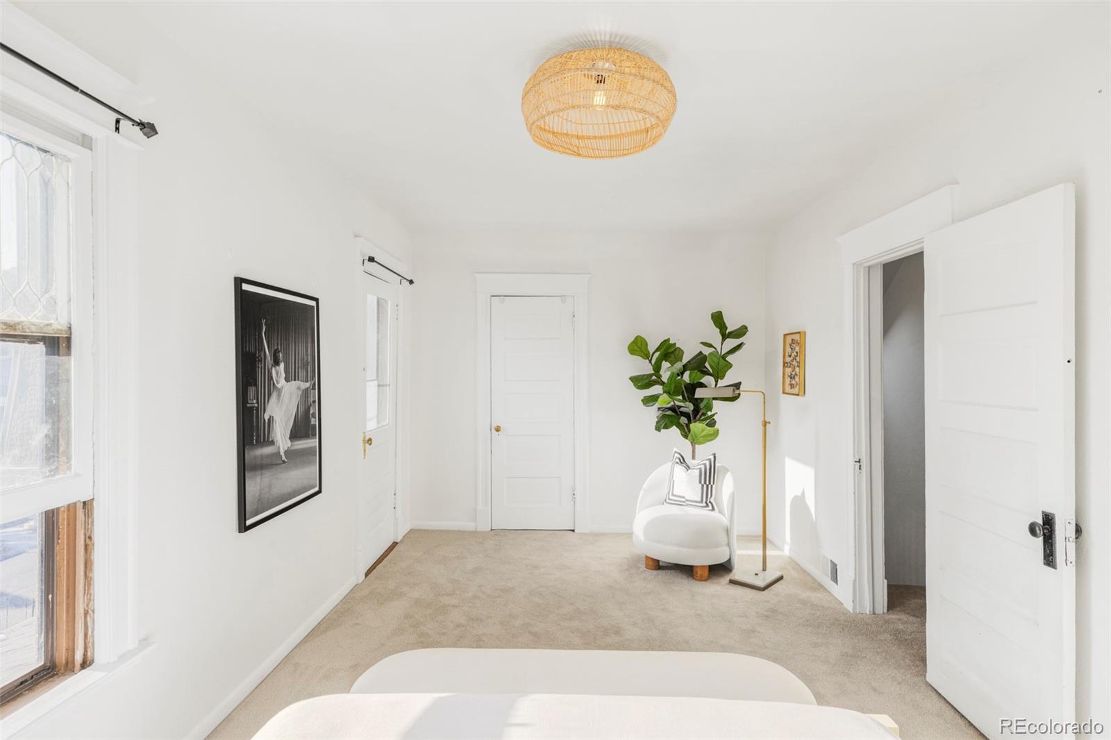 142 Logan Street Denver, CO 80203 - Photo 15 of 32 a view of an empty room and a window