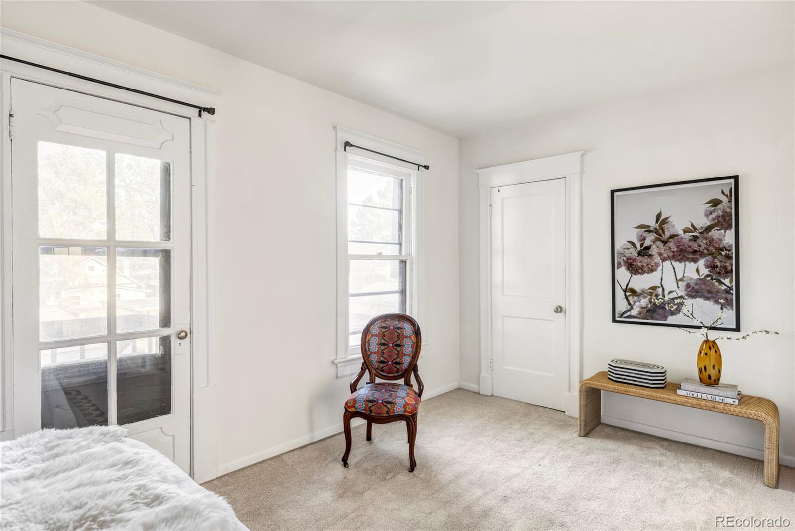 142 Logan Street Denver, CO 80203 - Photo 19 of 32 a bedroom with a bed and a window