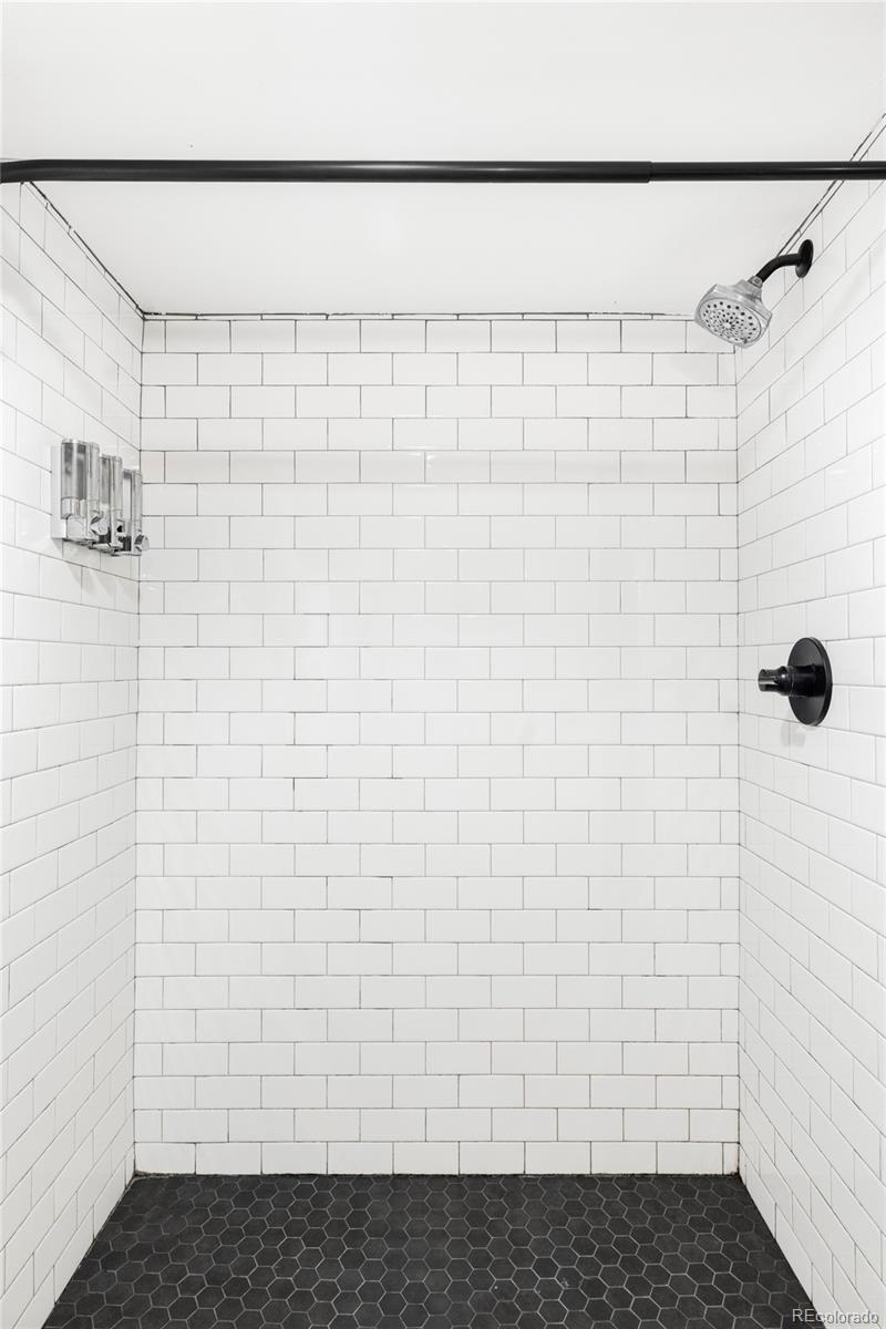 142 Logan Street Denver, CO 80203 - Photo 24 of 32 a bathroom with a shower